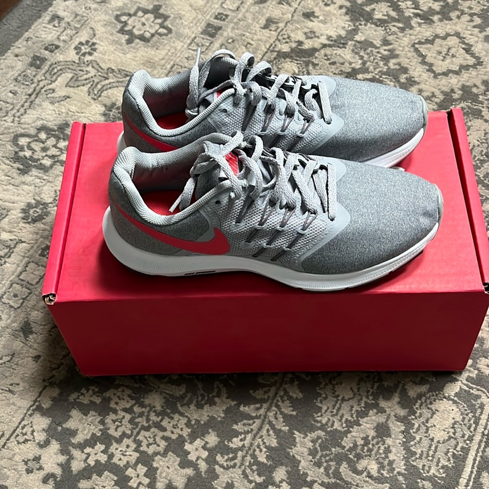 Nike Women’s Run Swift, Color Grey/Red, Size 6.5. Never worn.